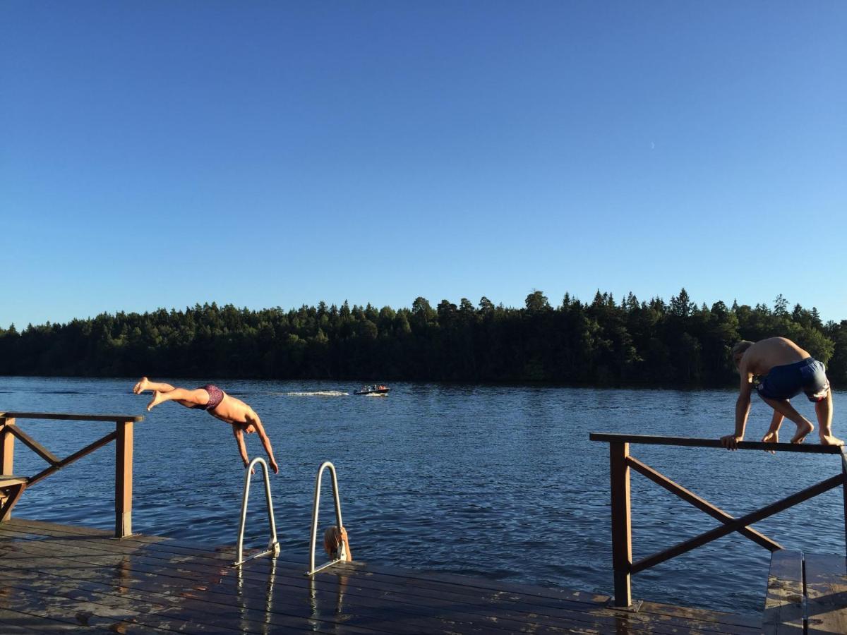 Family Near Sea And Villa Stockholm